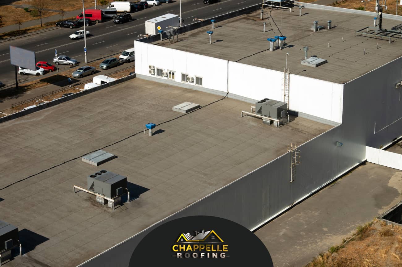 An aerial view of a large commercial building with a roof in Palmetto, FL.