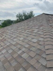 A brown shingled roof.
