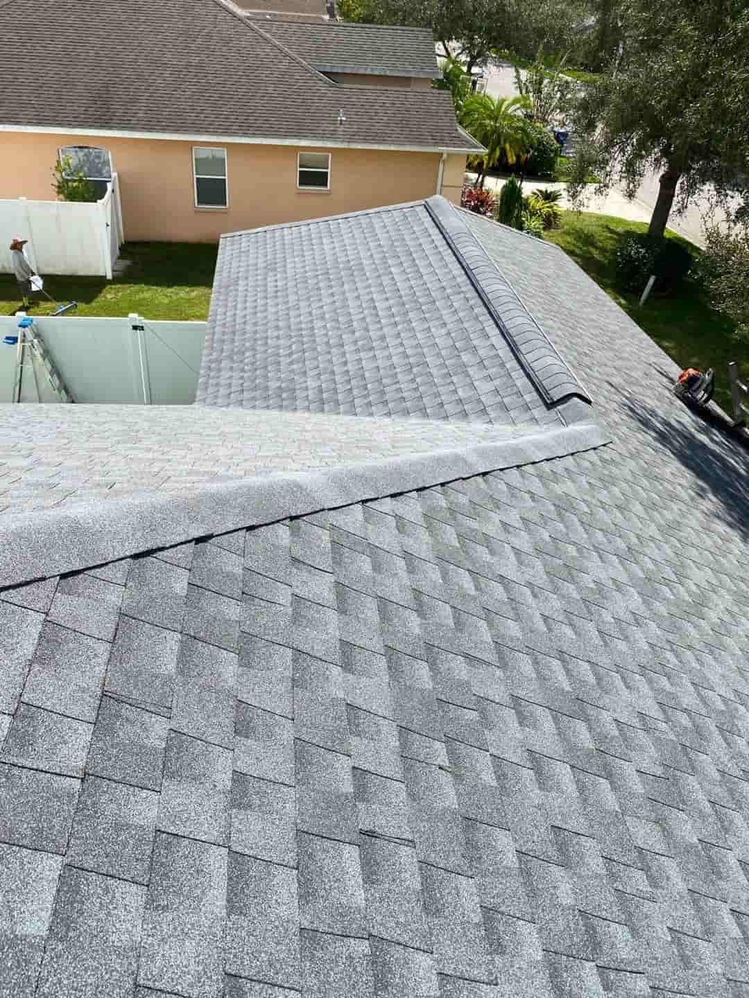 A roof with a gray shingled roof underwent shingle roof installation.